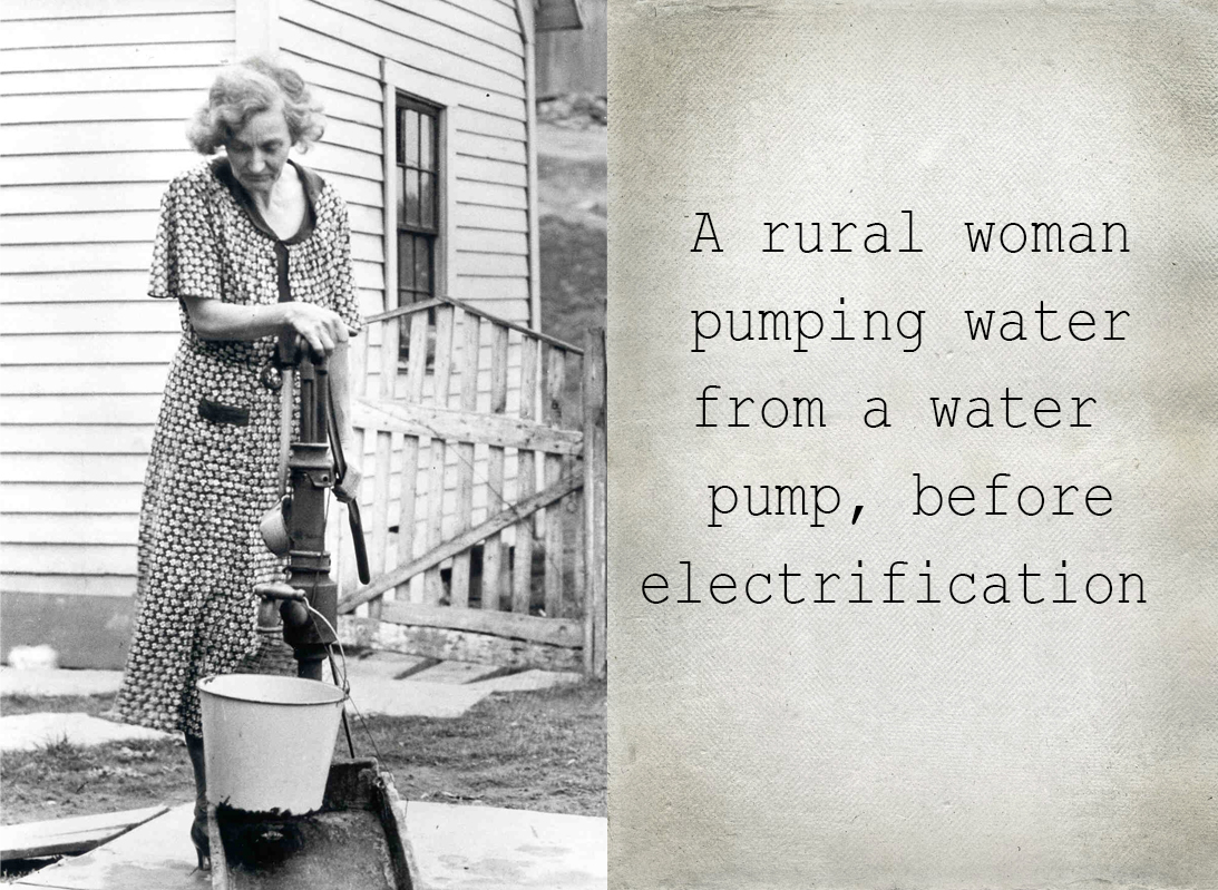 A rural woman pumping water from a water pump, before electrification