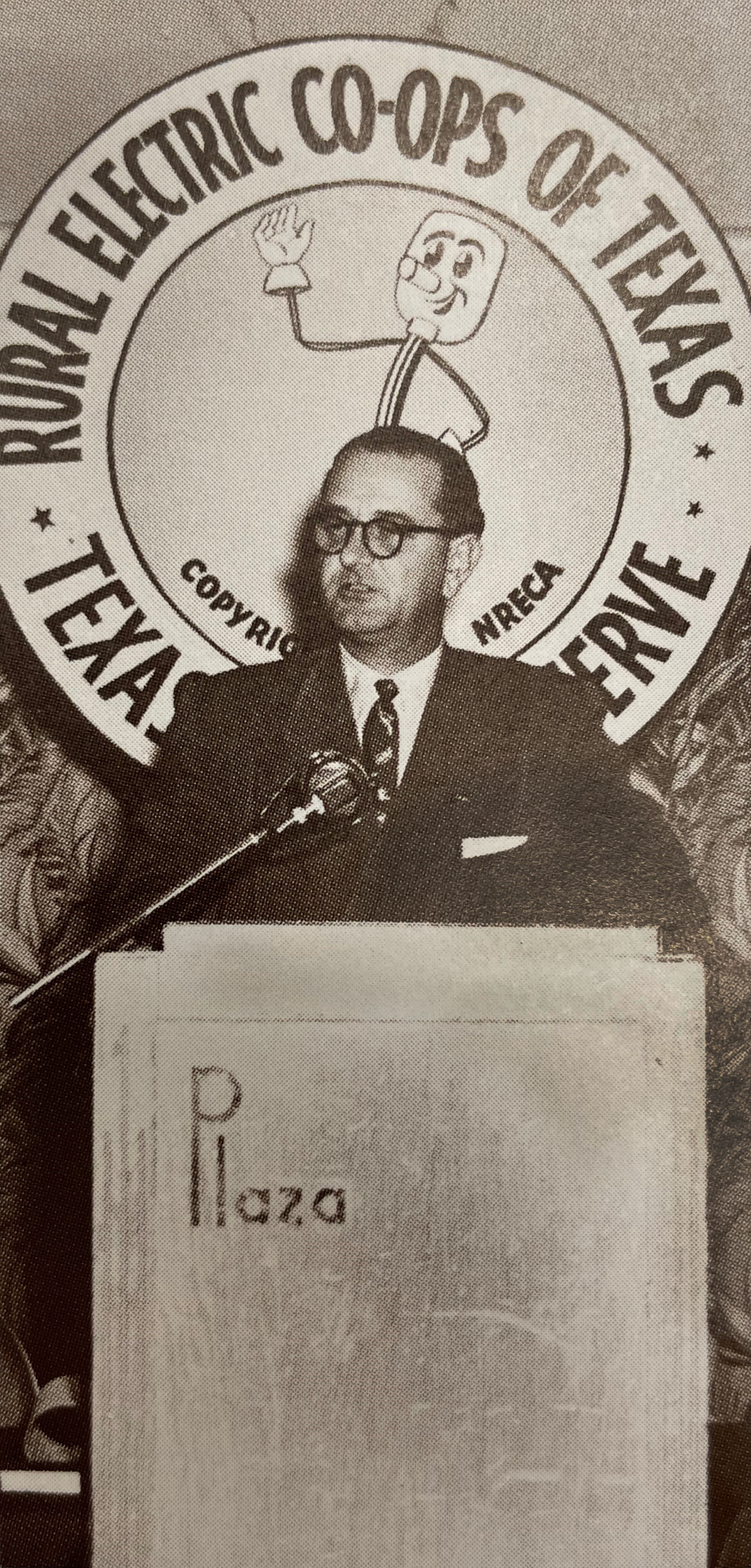 Pictured: Future President Lyndon B. Johnson speaks at a 1952 meeting of rural electric cooperatives, in front of the likeness of NRECA mascot Willie Wiredhand. LBJ continued to be a supporter of the REA during his presidency. Source: “The Next Greatest Thing,” published by NRECA