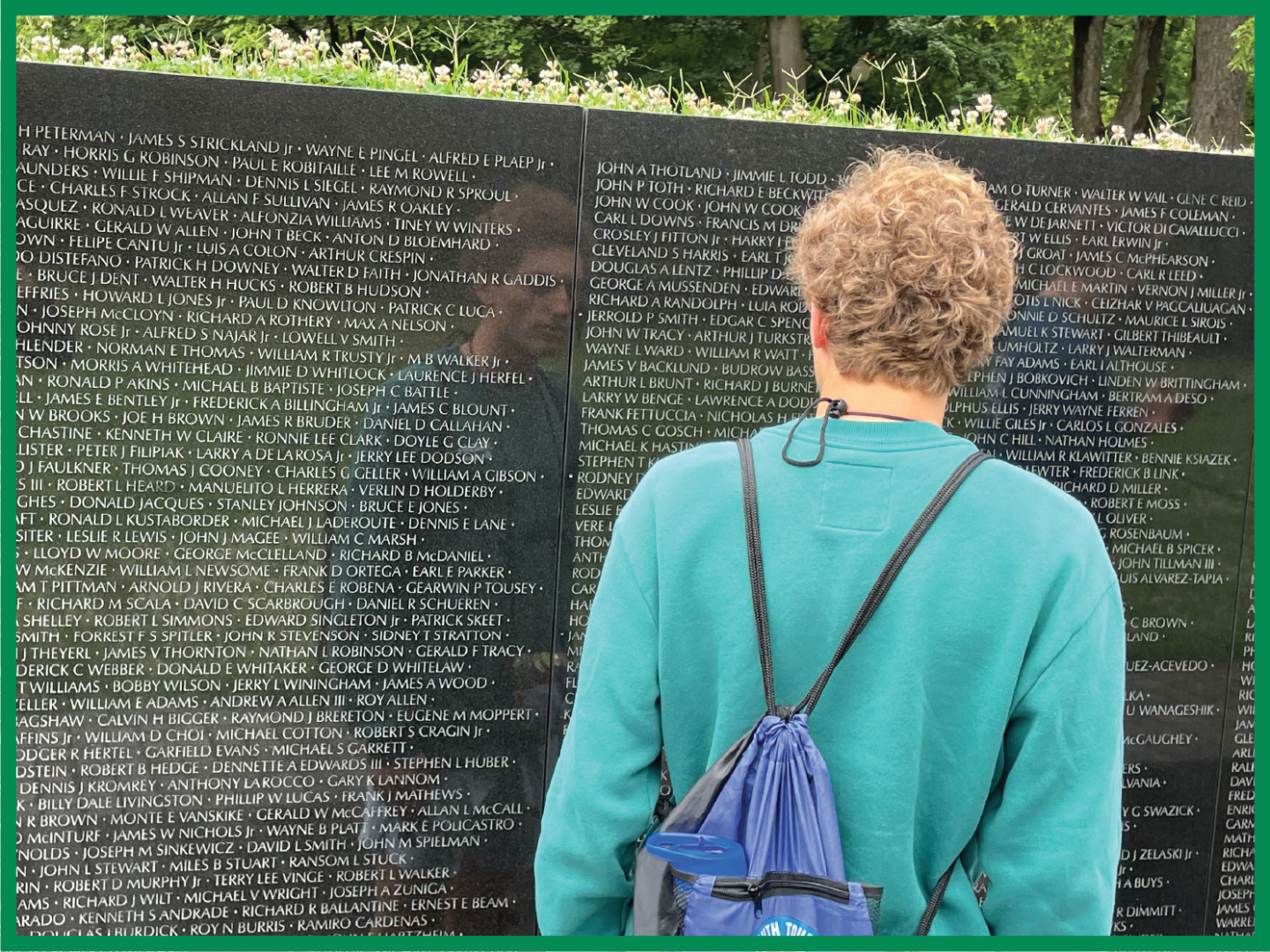A 2023 NJ Youth Tour students reads names on the memorial wall at the Vietnam War Memorial