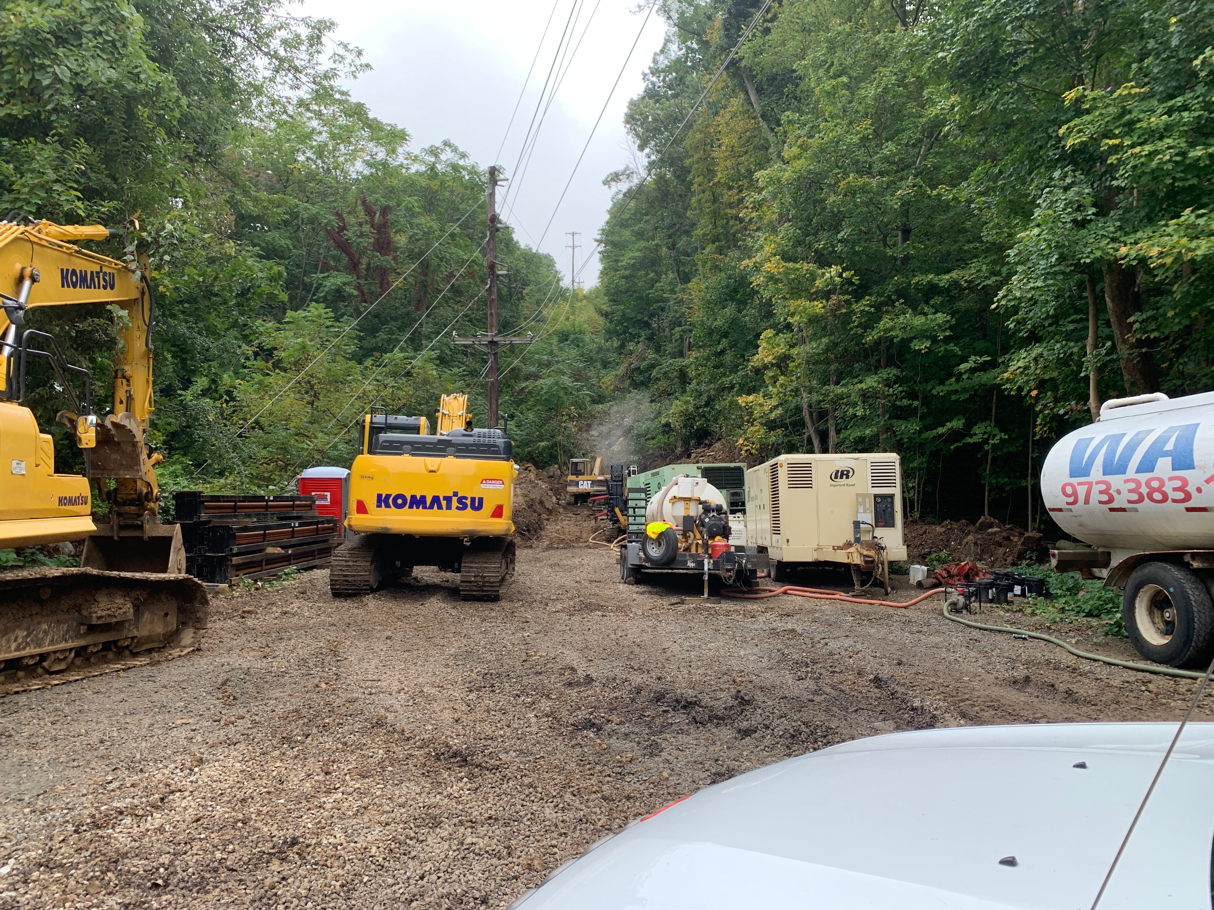 Various vehicles and equipment used in SREC's undergrounding project