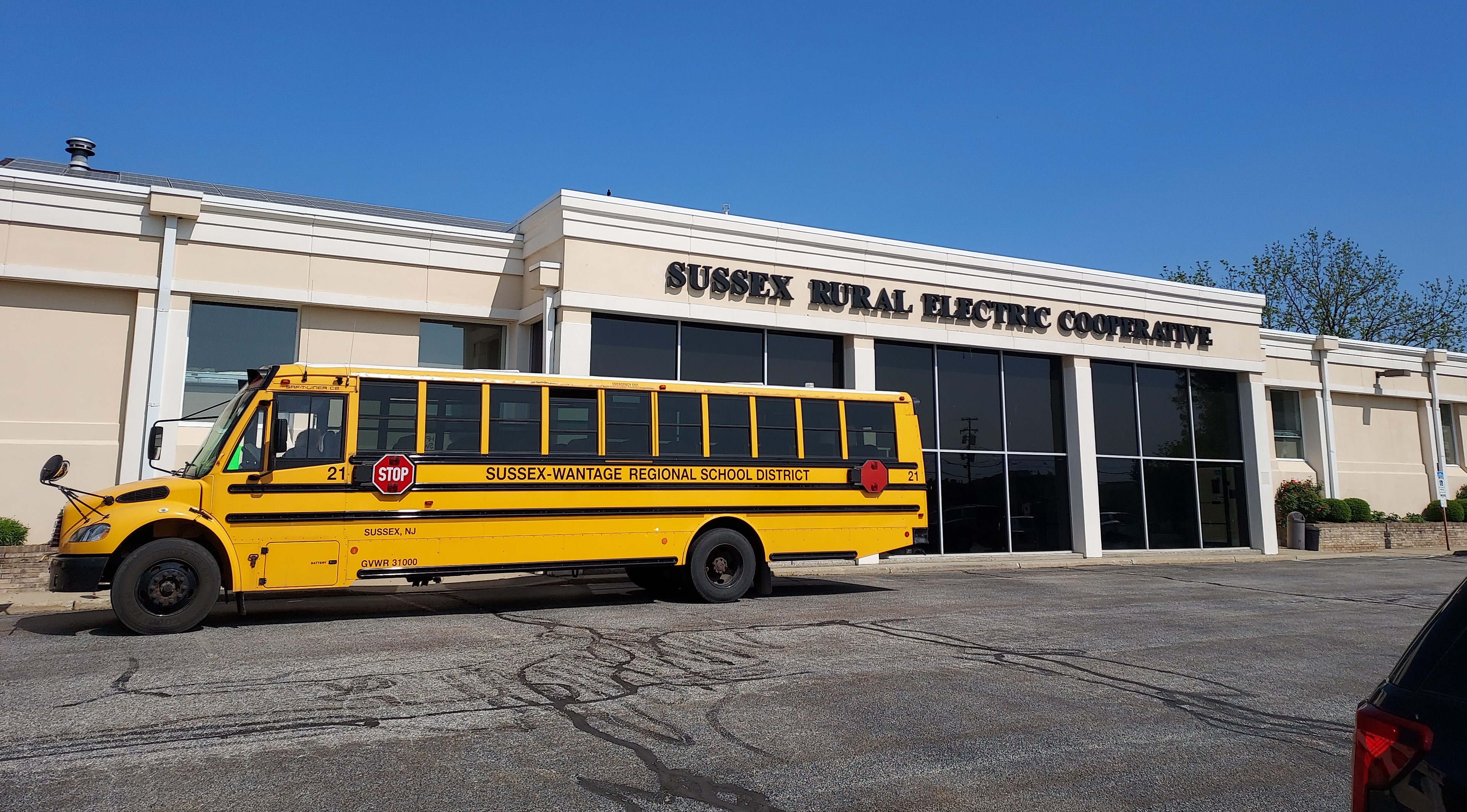Sussex-Wantage School Bus parked in front of Sussex Rural Electric Cooperative's office for a field trip